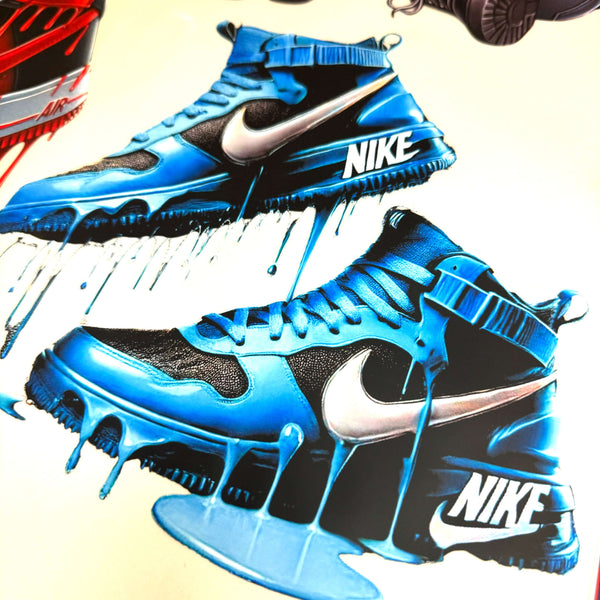 Blue sneakers with dripping paint design featuring Nike logo, showcasing bold colors and artistic details.