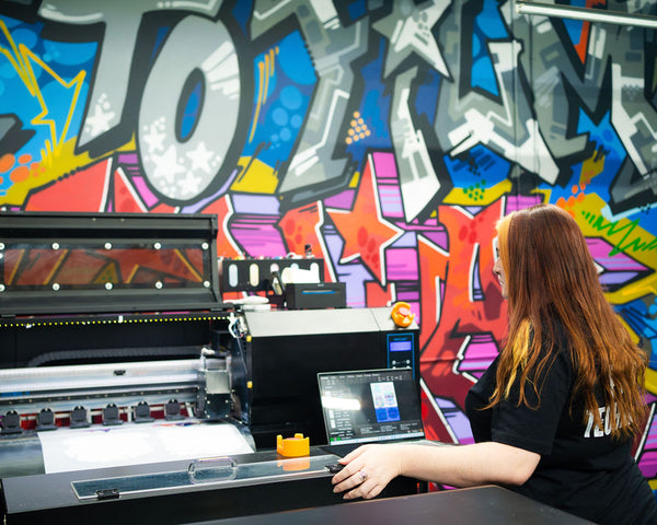 DTF Virginia printer producing custom gang sheet transfers with fast turnaround, ensuring printed orders ship within 24 to 48 hours for customers.