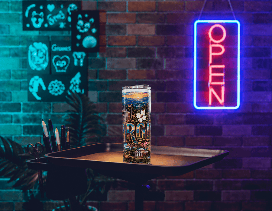 A full sleeve printed 20oz tumbler on a tray under a neon OPEN sign