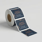 Roll of Harbor & Hearth product labels on a light gray background