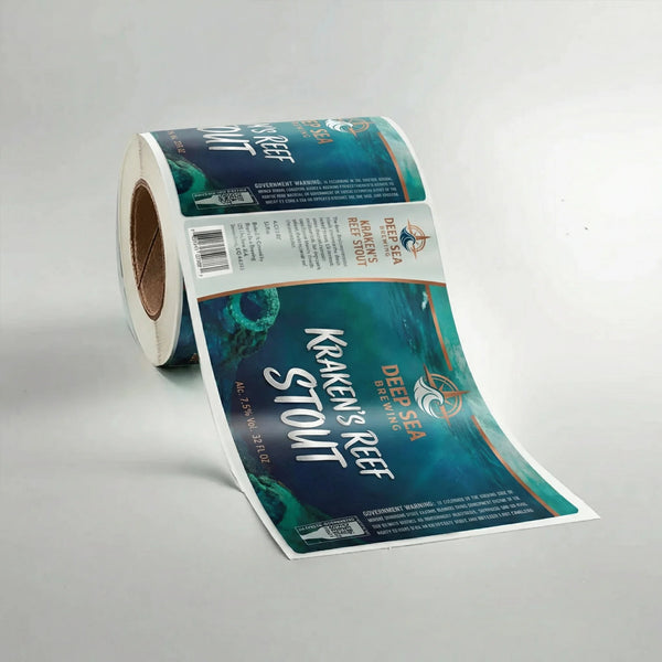 Roll of Kraken's Reef Deep Sea Brewing Stout labels on a gray background