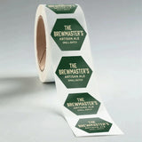 Roll of 'The Brewmaster's Artisan Ale' labels on a gray background