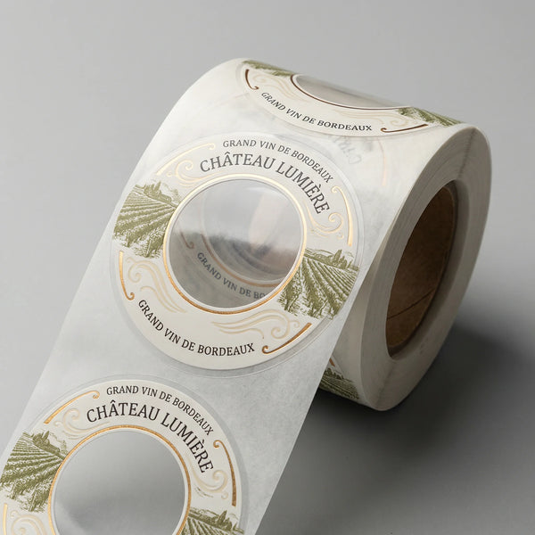 Roll of Château Lumière wine bottle labels on a gray background