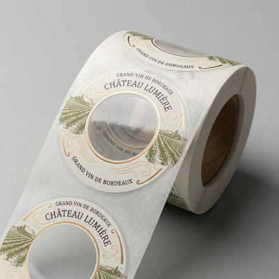 Roll of Château Lumière wine bottle labels on a gray background