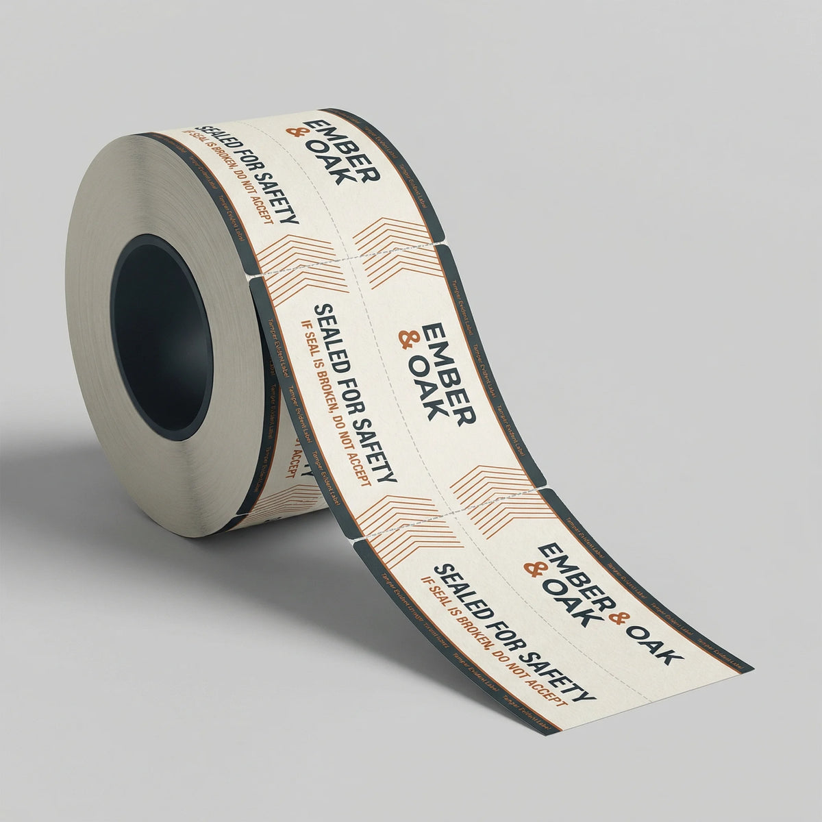 Roll of Ember & Oak branded tape on a gray background