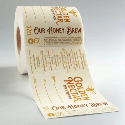 Roll of Golden Nectar Brewing Company label on a gray background