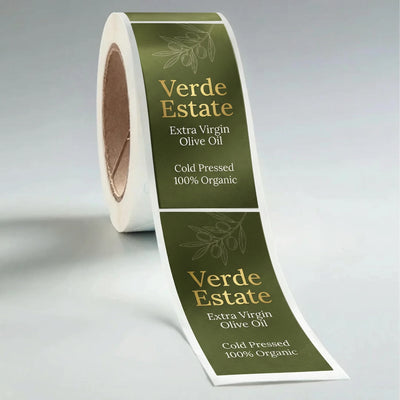 Roll of Verde Estate olive oil labels on a gray background