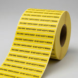 Roll of yellow labels with black text on a gray background
