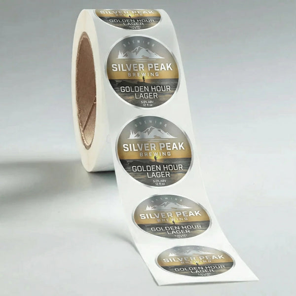Roll of Silver Peak Brewing Golden Hour Lager labels on a gray background