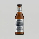 Bottle of Harbor Mist Stout with a label on a gray background