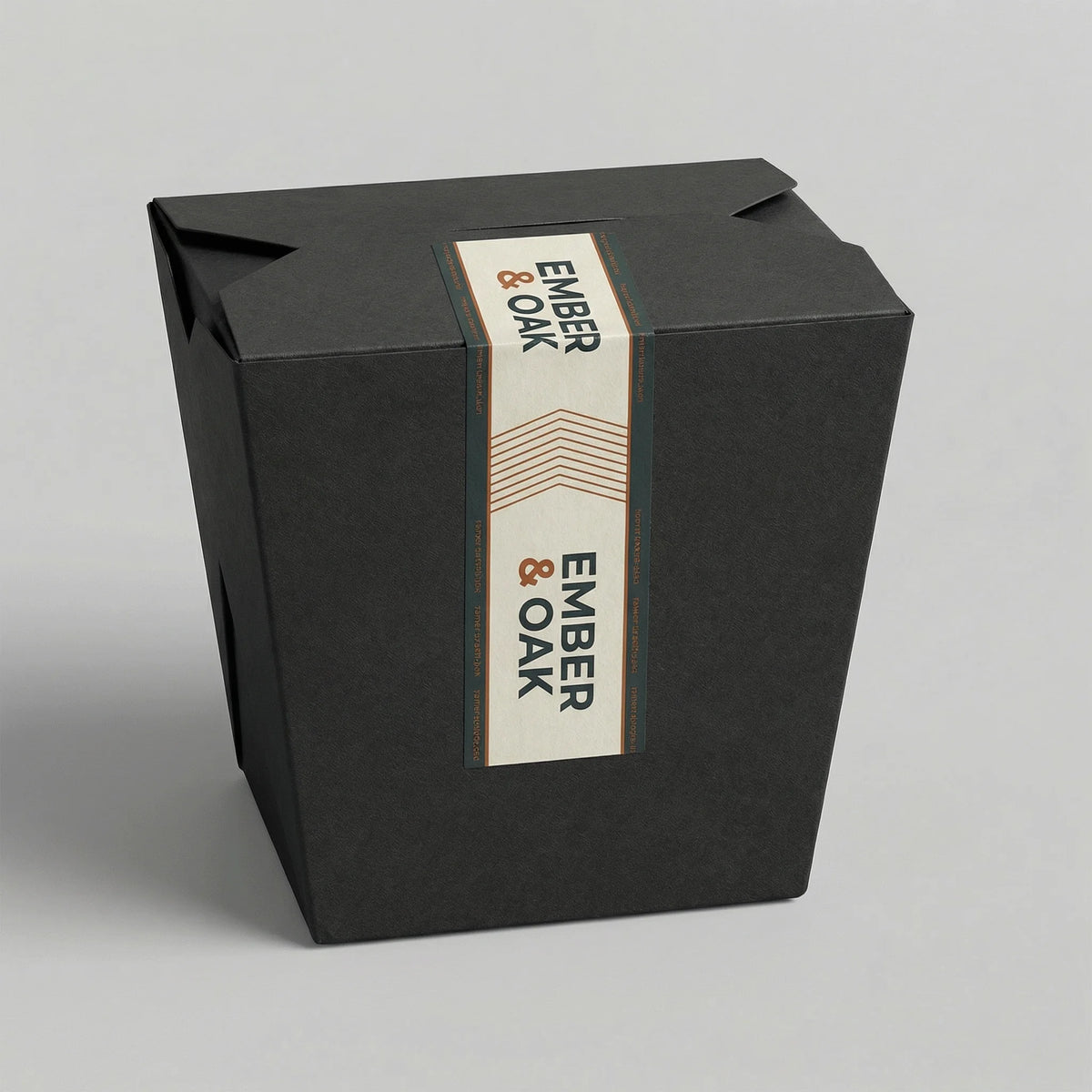 Black box with 'Ember & Oak' label on a gray background