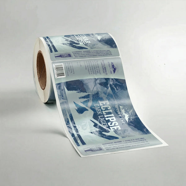 Roll of Eclipse Dark Lager labels on a gray background