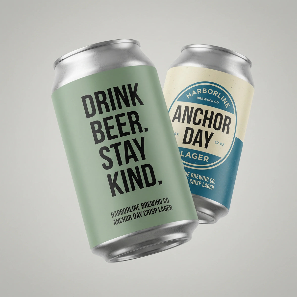 Two beer cans, one with 'Drink Beer. Stay Kind.' text and the other with 'Anchor Day' branding, on a gray background.