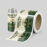 Roll of Summit Peak Brewing Co. Golden Trail Ale labels next to a can on a gray background