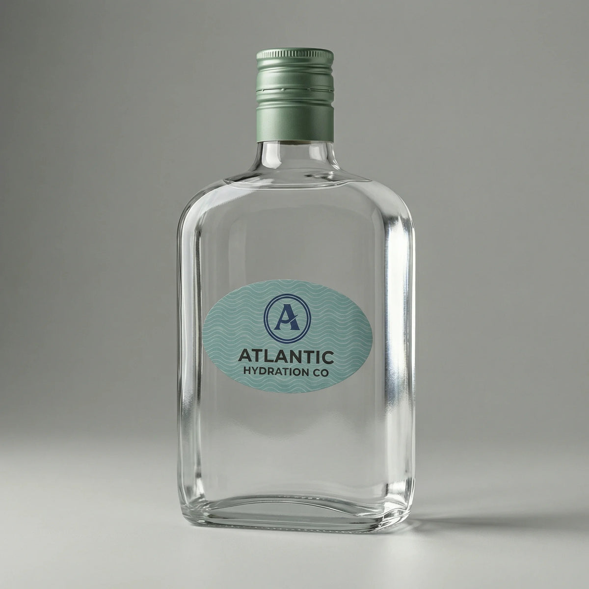 Clear glass bottle with a green cap and 'Atlantic Hydration Co' label on a gray background
