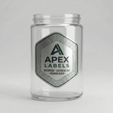Clear glass jar with Apex Labels label on a white background