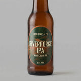 Brown beer bottle with 'Riverforge IPA' label on a gray background