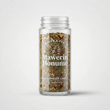 Clear jar filled with herbs and spices labeled 'Mawerin Honume' on a white background