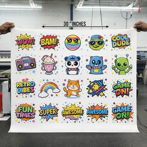 gangsheet of colorful stickers with various designs and text held by two hands.