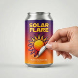 Can of Solar Flare blood orange soda with a hand opening it on a light gray background