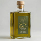 Bottle of Verde Estate Extra Virgin Olive Oil with a cork lid on a light gray background
