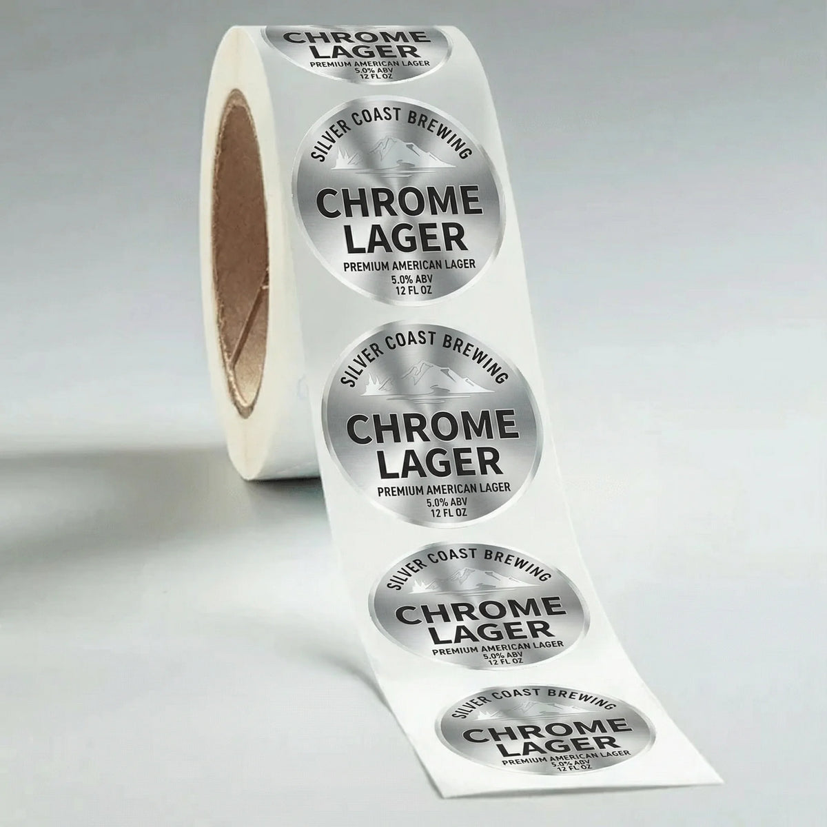 Roll of Chrome Lager beer labels on a gray background