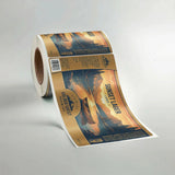 Roll of Golden West Sunset Lager labels on a gray background