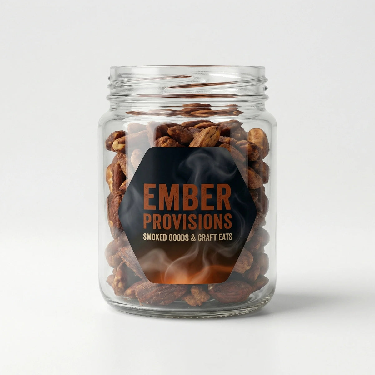 Glass jar with smoked goods labeled 'Ember Provisions' on a white background