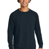 Next Level Apparel ®  Laguna Raglan Sweatshirt NL9000 model wearing navy sweatshirt with raglan sleeves.