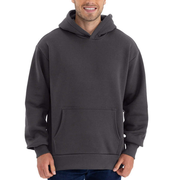 Man wearing Next Level Apparel ®  Heavyweight Hoodie NL9307 in dark gray, featuring a front pouch pocket and oversized fit.